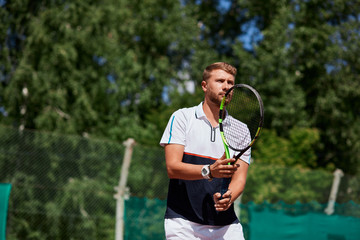 Returner hitting ball on tennis court, thereby lucky sportsman breaks serve from his opponent