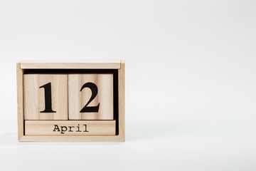 Wooden calendar April 12 on a white background