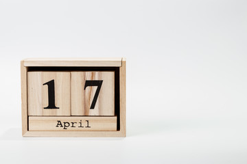 Wooden calendar April 17 on a white background
