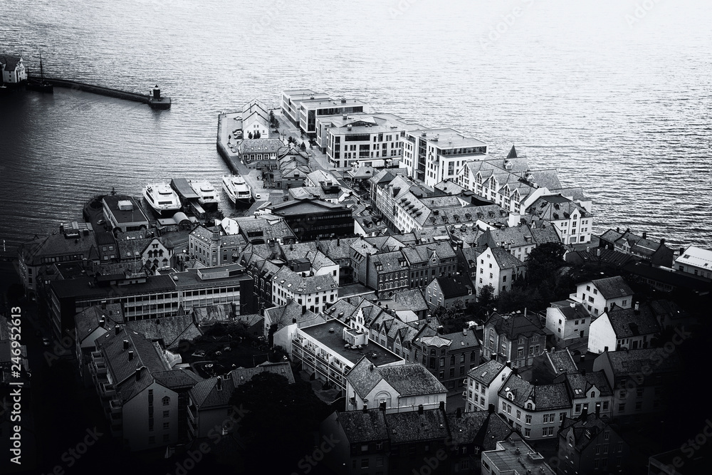 Canvas Prints Panoramic view of the archipelago, the beautiful Alesund town centre and the amazing Sunnmore Alps from Fjellstua  Viewpoint, More og Romsdal, Norway. Black and white image.