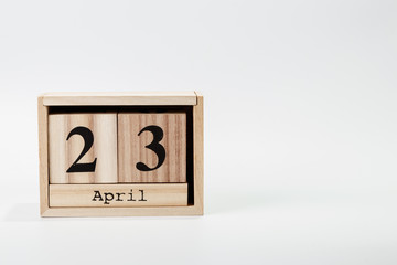 Wooden calendar April 23 on a white background