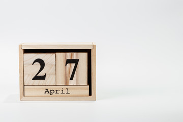 Wooden calendar April 27 on a white background