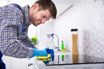 Man Cleaning Induction Stove