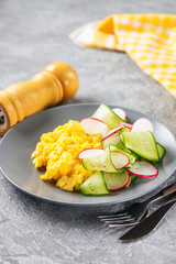 Scrambled  eggs with cucumber and radish