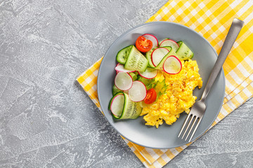 Scrambled  eggs with cucumber and radish