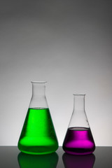 Liquid in laboratory bottles. Scientific biochemical laboratory. Colorful liquid.