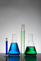 Liquid in laboratory bottles. Scientific biochemical laboratory. Colorful liquid.