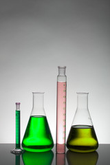 Liquid in laboratory bottles. Scientific biochemical laboratory. Colorful liquid.