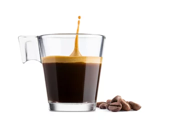 Zelfklevend Fotobehang Black coffee in glass cup with coffee beans and  jumping drop on white background © winston