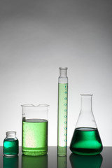 Liquid in laboratory bottles. Scientific biochemical laboratory. Colorful liquid.