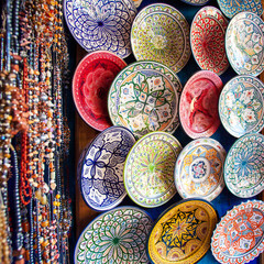 Colored Tajine, plates and pots out of clay on the market in Mor