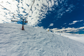 Fototapeta na wymiar New Zealand mountain panorama and ski slopes as seen from Coronet Peak ski resort, Queenstown
