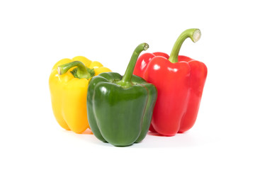 Red, yellow, green fresh and healthy peppers on white background