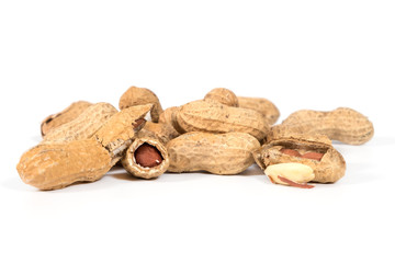 Raw tasty peanuts on white background