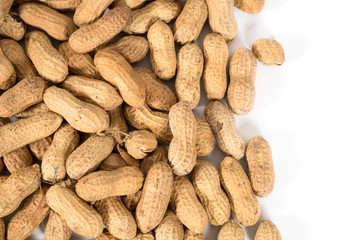 Raw tasty peanuts on white background