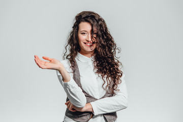 Portrait of attractive business woman on white background. With plenty of copy space. With beautiful curly hair