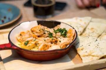 Pan fried shrimps in sauce in a restaurant