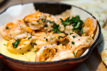 Pan fried shrimps in sauce in a restaurant