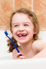 Laughing happy child lost primary tooth