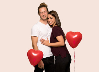 Fototapeta na wymiar Couple in valentine day hugging over isolated background