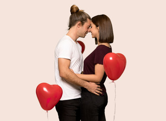 Fototapeta na wymiar Couple in valentine day with happy expression over isolated background