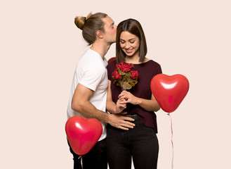 Fototapeta na wymiar Couple in valentine day with flowers over isolated background