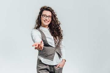 Funny portrait of an excited woman in glasses sunglasses. Close-up of a portrait of a young professional business woman makes the expression a funny face isolated on white background. Ready to