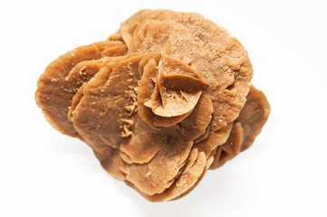 Souvenir from the Sahara Desert on a white background - a rose made from minerals, sand and water