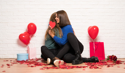 Couple in valentine day hugging and with a rose