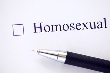 Checklist with a word Homosexual on white paper. Checkbox concept.