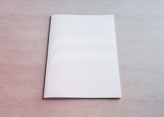 White magazine cover mockup on wood 3d rendering