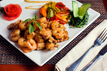 Chicken Marengo - French dish consisting of a chicken and shrimps with garlic and tomato. Food and restaurant concept