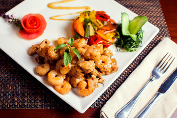 Chicken Marengo - French dish consisting of a chicken and shrimps with garlic and tomato. Food and restaurant concept