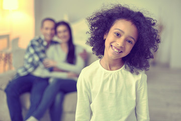 Young cheerful kid demonstrating a positive approach.