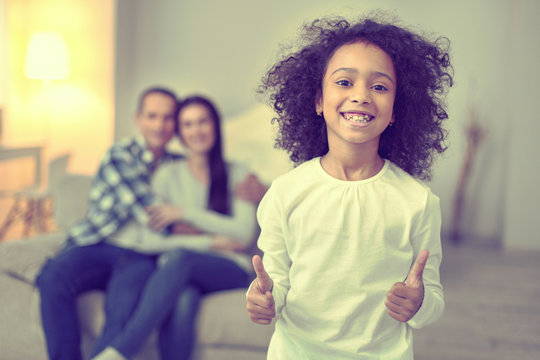 Little Smiling Girl Showing An Optimistic Outlook On Life.