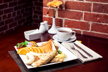 Healthy Full American Breakfast with Pancakes, Banana and toasts with butter. Food and restaurant concept