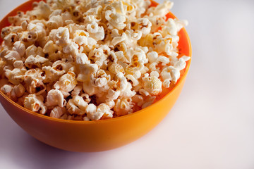 A bowl with popcorn isolated on white background. Food concept