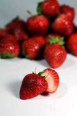 Red strawberry on white background and space for write wording, popular western fruit feed in higher part of Thailand, feel good meaningful fruit for love especially for valentines events