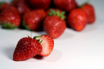 Red strawberry on white background and space for write wording, popular western fruit feed in higher part of Thailand, feel good meaningful fruit for love especially for valentines events