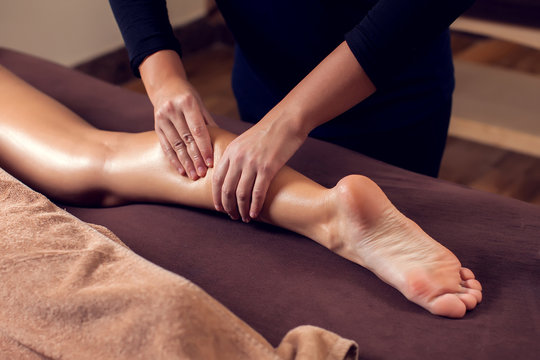 Woman receiving and enjoying a foot massage at the spa salon © Aleksej