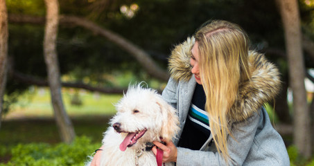 Young girl with her dog in a park