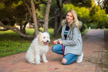 Young girl with her dog in a park