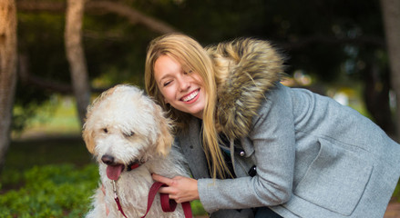 Young girl with her dog in a park