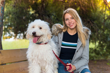 Young girl with her dog in a park