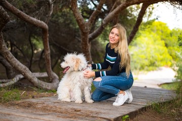 Young girl with her dog in a park