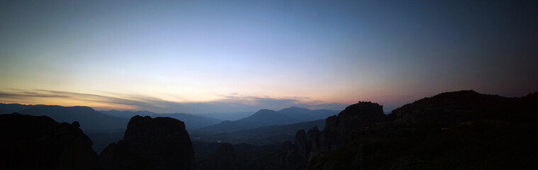 Obraz na płótnie Canvas panoramic view of a Meteora sunset with some of its rocks