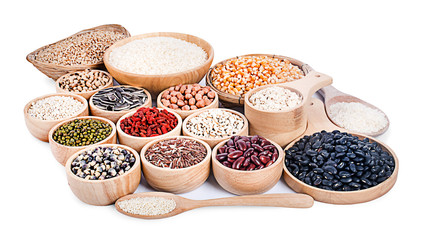 Cereal grains , seeds, beans on wooden background
