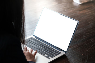 Casual business woman works online on laptop which hand on keyboard in her house Isolated screen in laptop blank white screen.