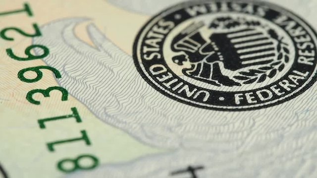 Federal Reserve System Seal on US 20 dollar bill macro slow rotating. Low angle. Stock video footage