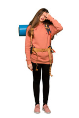 Full-length shot of Hiker girl with tired and sick expression on isolated white background
